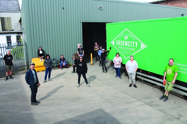 Greencity members stood in the yard during covid socially distanced